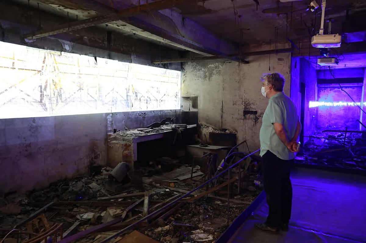 British journalist David Bergman views the artwork created from the ruins of the Prothom Alo building that was set ablaze by extremists. Karwan Bazar, Dhaka; 27 February 2026.