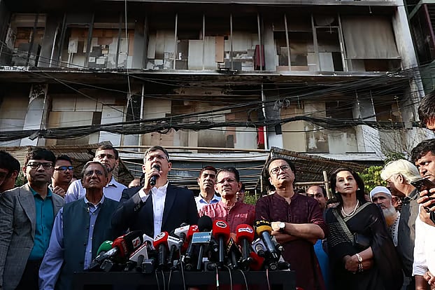 After visiting the exhibition held in the burnt-down building of Prothom Alo, Home Minister Salahuddin Ahmed speaks to journalists. Karwan Bazar, Dhaka; 28 February 2026.