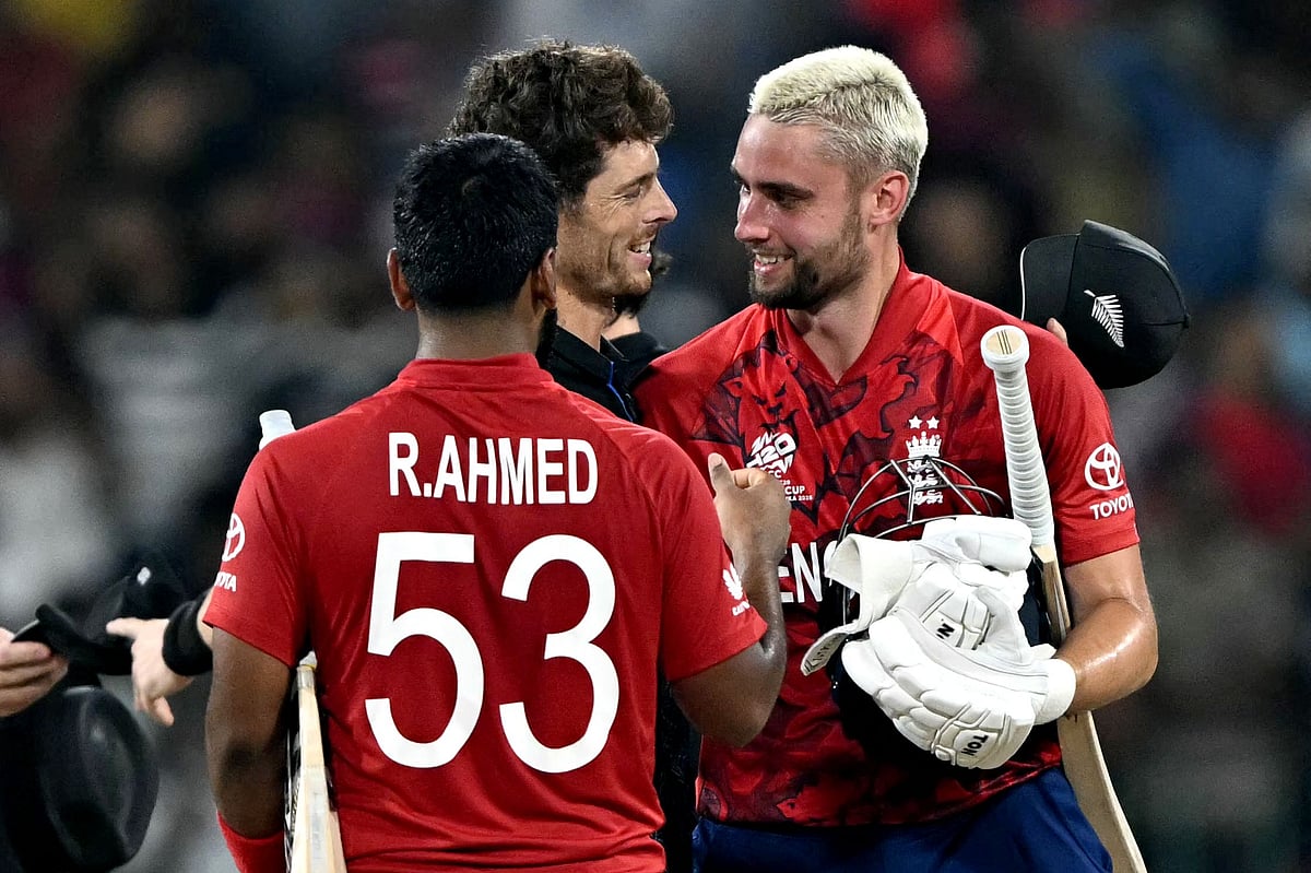 New Zealand's captain Mitchell Santner (C) congratulates England's Will Jacks (R) after their win in the 2026 ICC Men's T20 Cricket World Cup Super Eights match between England and New Zealand at the R Premadasa Stadium in Colombo on 27 February 2026.