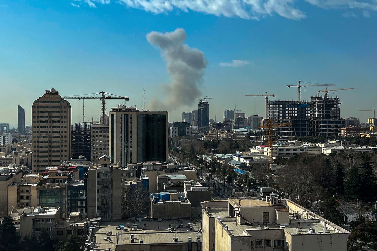 A plume of smoke rises following a reported explosion in Tehran on 28 February 2026. 