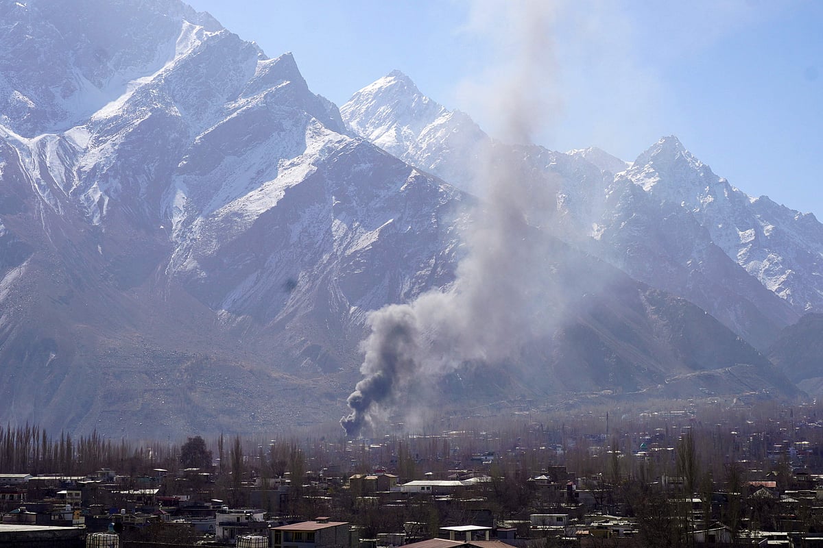 Smoke billows after Shiite Muslim protesters set fire to a United Nations office during an anti-US and Israel protest in Skardu in Pakistan's Gilgit-Baltistan region on March 1, 2026.
