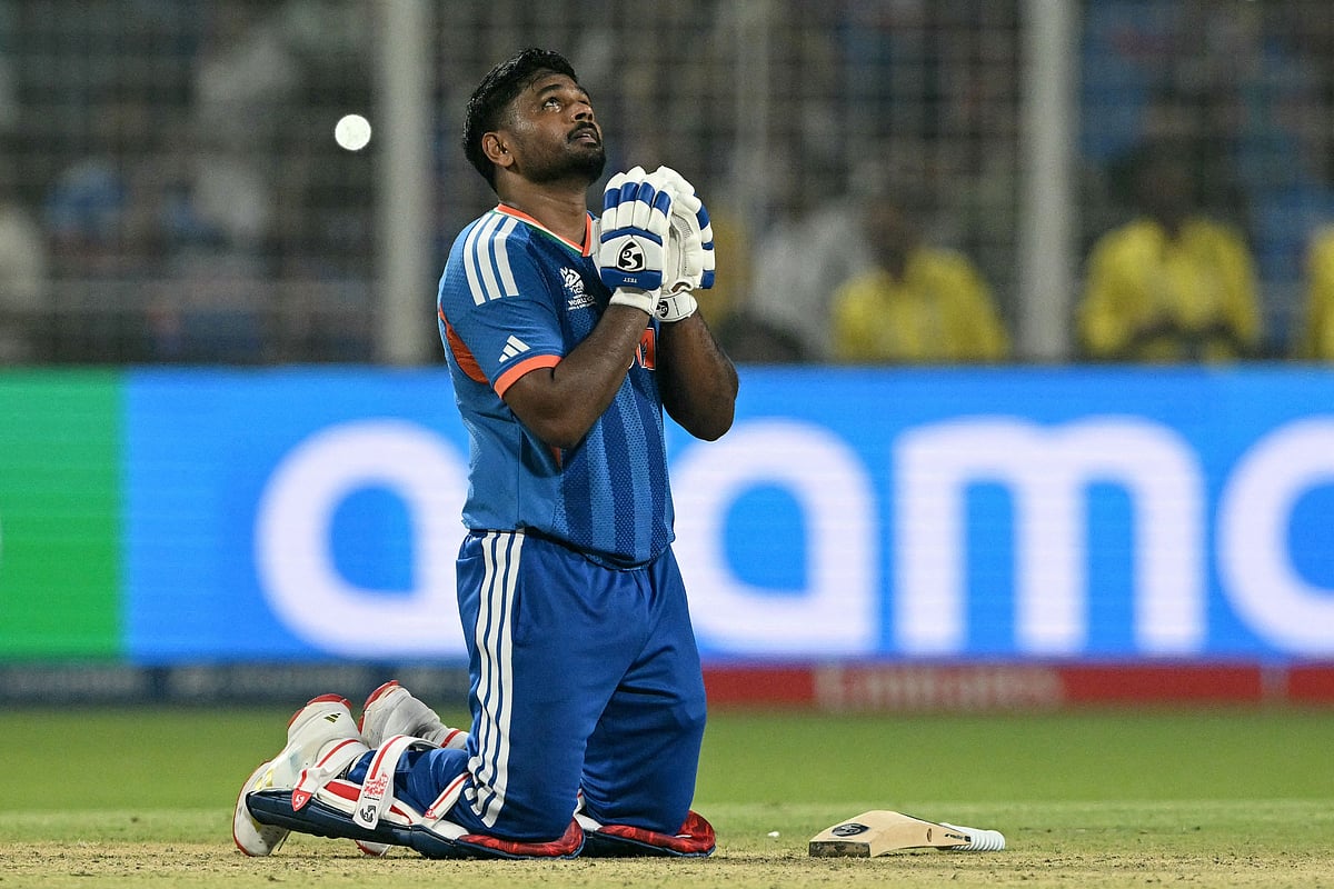 India's Sanju Samson prays as he celebrates his team's win against West Indies at the end of their 2026 ICC Men's T20 Cricket World Cup Super Eights match in the Eden Gardens, Kolkata on March 1, 2026