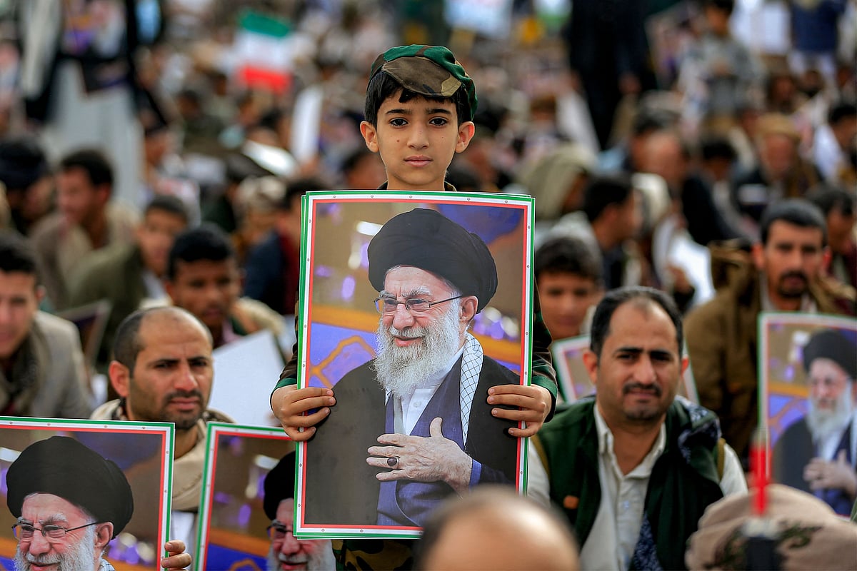 A boy holds a picture of Iran's supreme leader Ali Khamenei during a memorial rally held by supporters of Yemen's Huthis, a day after Khamenei was assassinated during US and Israeli strikes on Tehran, in the Huthi-held capital Sanaa on 1 March, 2026. The United States and Israel launched strikes against Iran on 28 February, killing Iran's supreme leader and top military leaders, prompting authorities to retaliate with strikes on Israel and US bases across the Gulf.