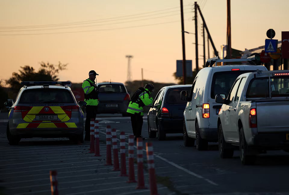 Police check vehicles on the road leading to RAF Akrotiri, a British sovereign base in Cyprus, which was hit by an unmanned drone overnight, causing limited damage, Cyprus March 2, 2026.