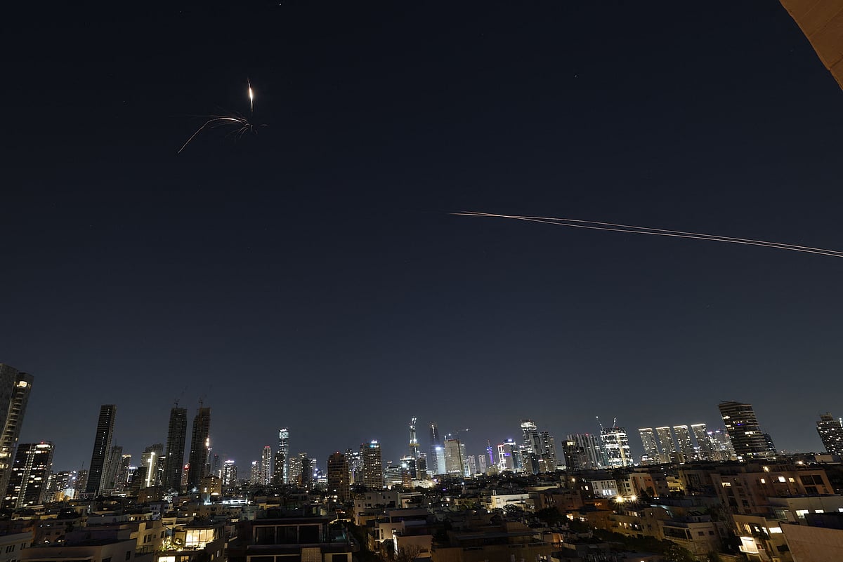Rocket trails are seen in the sky amid a fresh barrage of Iranian missile attacks above the Israeli coastal city of Tel Aviv on 3 March, 2026.