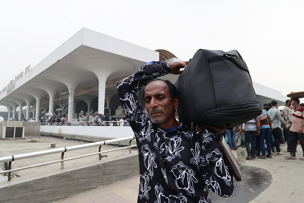 A passenger returns from the airport after the cancellation of flights. Photo taken at the Hazrat Shahjalal International Airport in Dhaka on 2 March 2026.