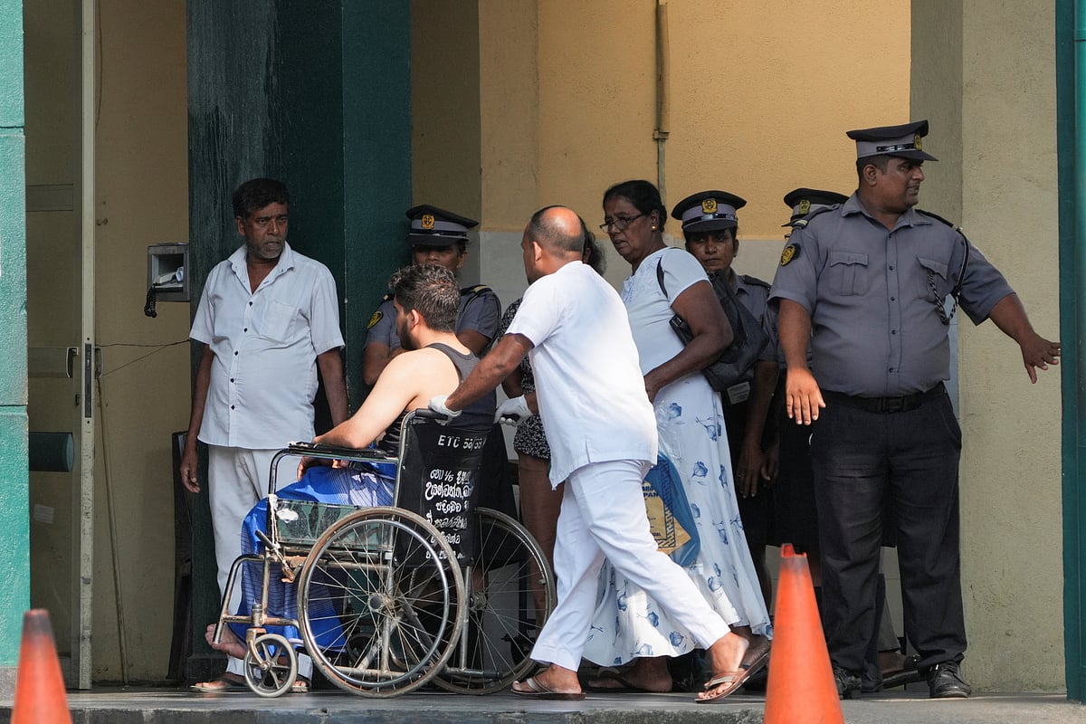 An injured person moves on a wheelchair at the National Hospital Galle where he will receive treatment after a submarine attack on an Iranian ship off Sri Lanka, in Galle, Sri Lanka, on 4 March 2026.