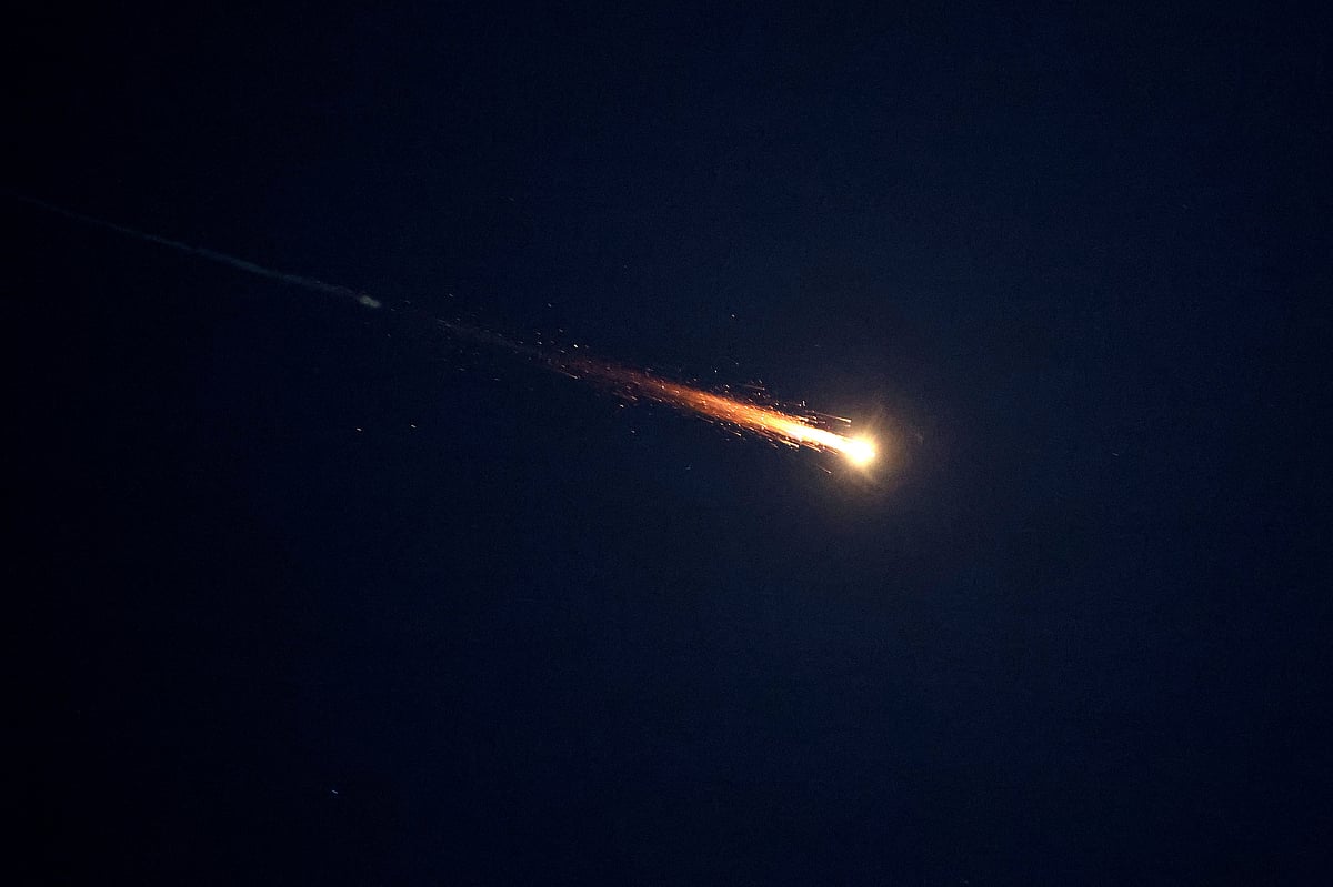 Rocket trails are seen in the sky above Netanya amid a fresh barrage of Iranian missile attacks on 3 March 2026