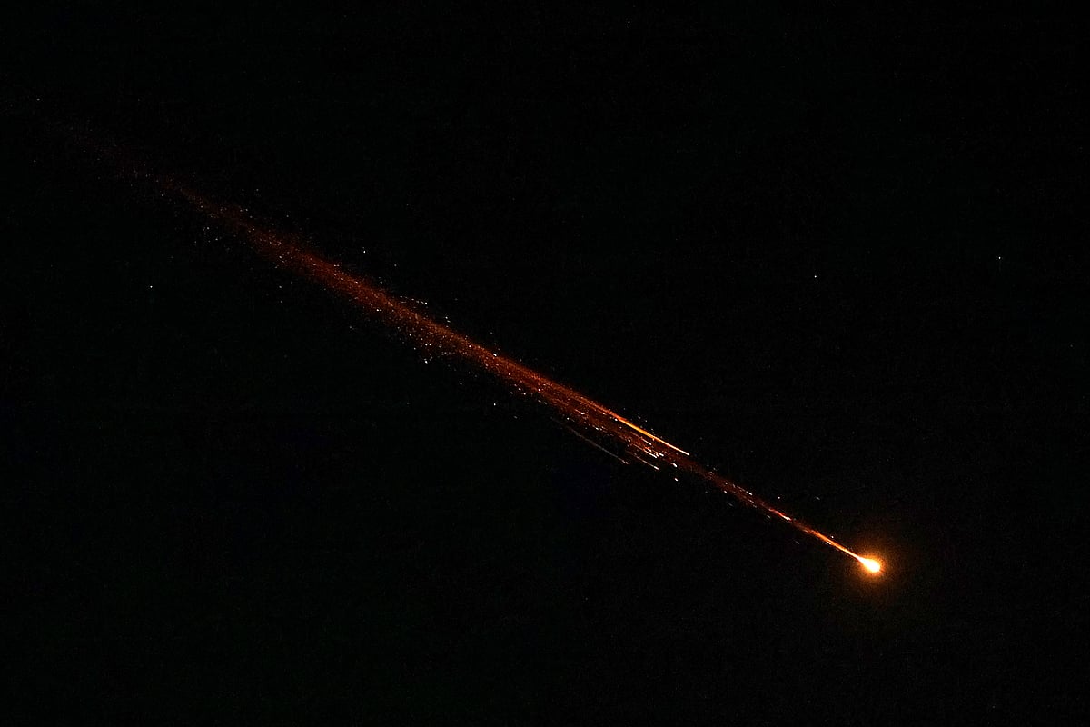 Rocket trails are seen in the sky above the Israeli coastal city of Netanya during a barrage of Iranian missile attacks on March 5, 2026. The Israeli military said it detected multiple missile barrages from Iran on March 4, as well as launches from Lebanon, triggering air raid sirens across the country.