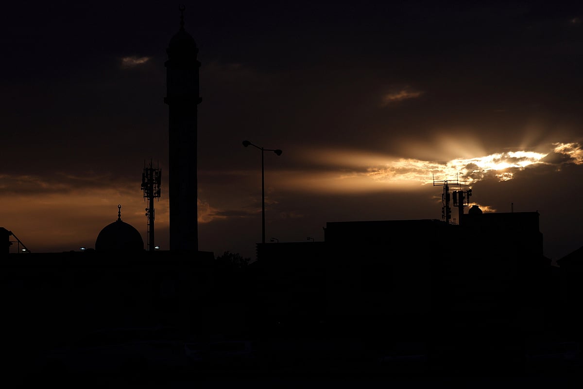 The sun sets over city of Doha on 6 March 2026. Qatar on 6 March said its naval forces were inside buildings targeted by Iran in Bahrain overnight, though they were unharmed, after Manama reported attacks on residential buildings and a hotel. The Gulf has borne the brunt of Iran's retaliation since US-Israeli strikes sparked war on Saturday, with Tehran striking US assets but also civilian infrastructure in the region.
