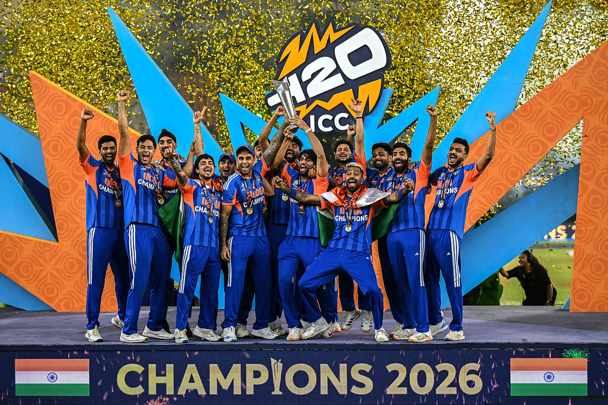 India's players celebrate with the trophy after winning the 2026 ICC Men's T20 Cricket World Cup final match against New Zealand at the Narendra Modi Stadium in Ahmedabad on March 8, 2026