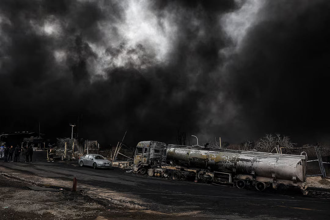 Smoke rises after a reported strike on Shahran fuel tanks in Tehran, Iran, 8 March 2026.