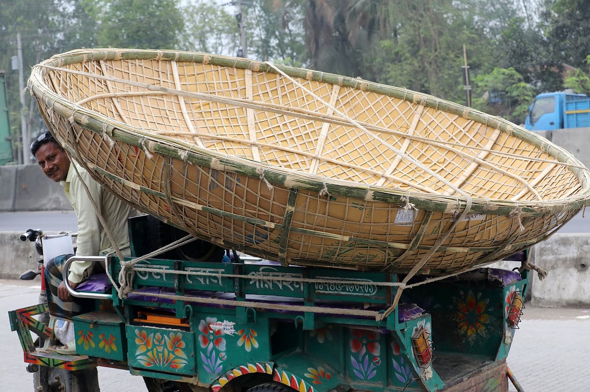 A driver transports new yoghurt lids to the factory by van. Noymile, Shahjahanpur, Bogura, 14 March.