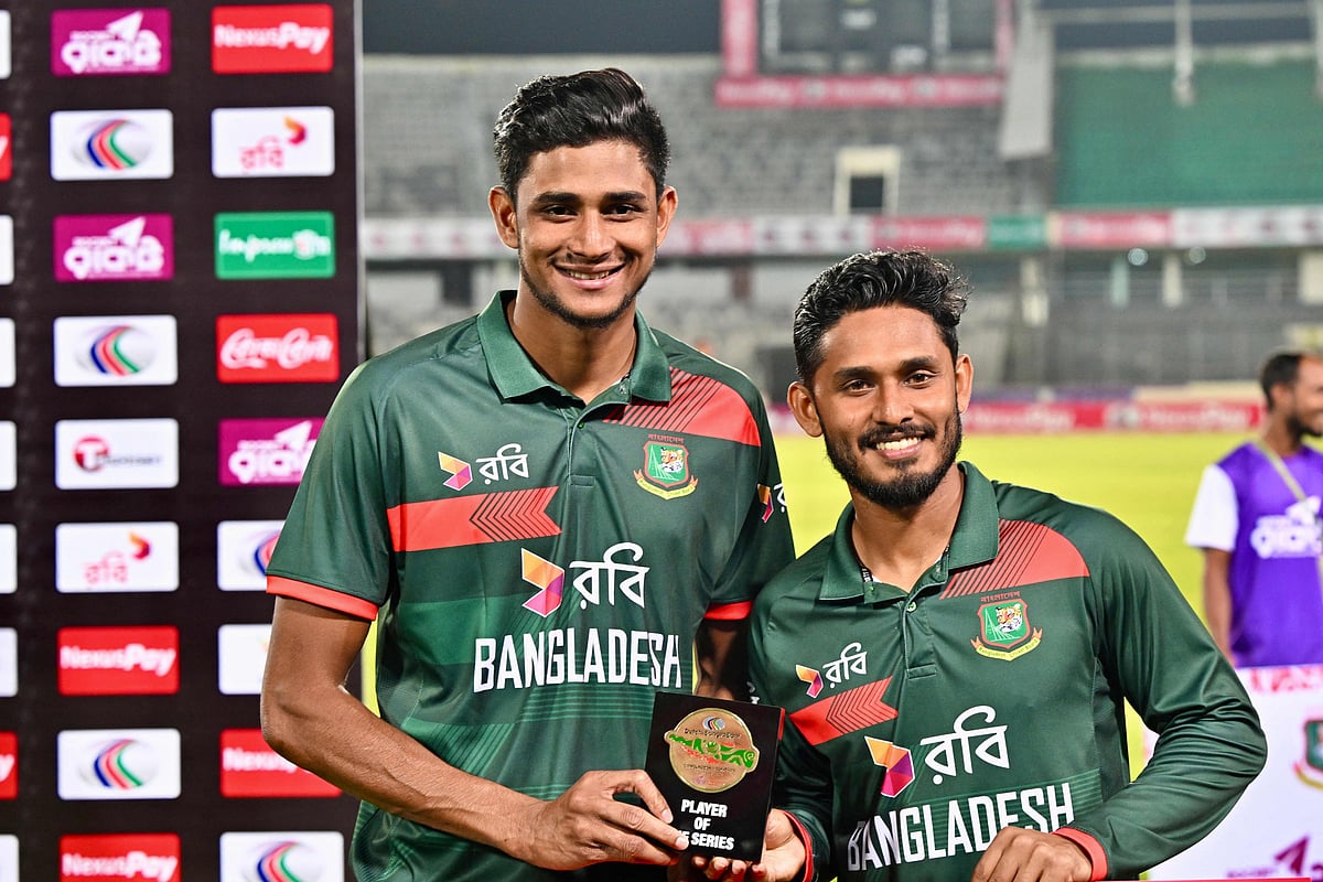 Bangladesh'S Tanzid Hasan Tamim (R) and Nahid Rana (L) pose with their respective 'Man of the Series' and 'Man of the Match' trophies after the third one-day international (ODI) cricket match between Bangladesh and Pakistan at Sher-e-Bangla National Stadium in Mirpur on March 15, 2026