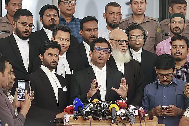 Mohammad Tajul Islam speaks to journalists on the day he stepped down from the International Crimes Tribunal on 23 February 2026.