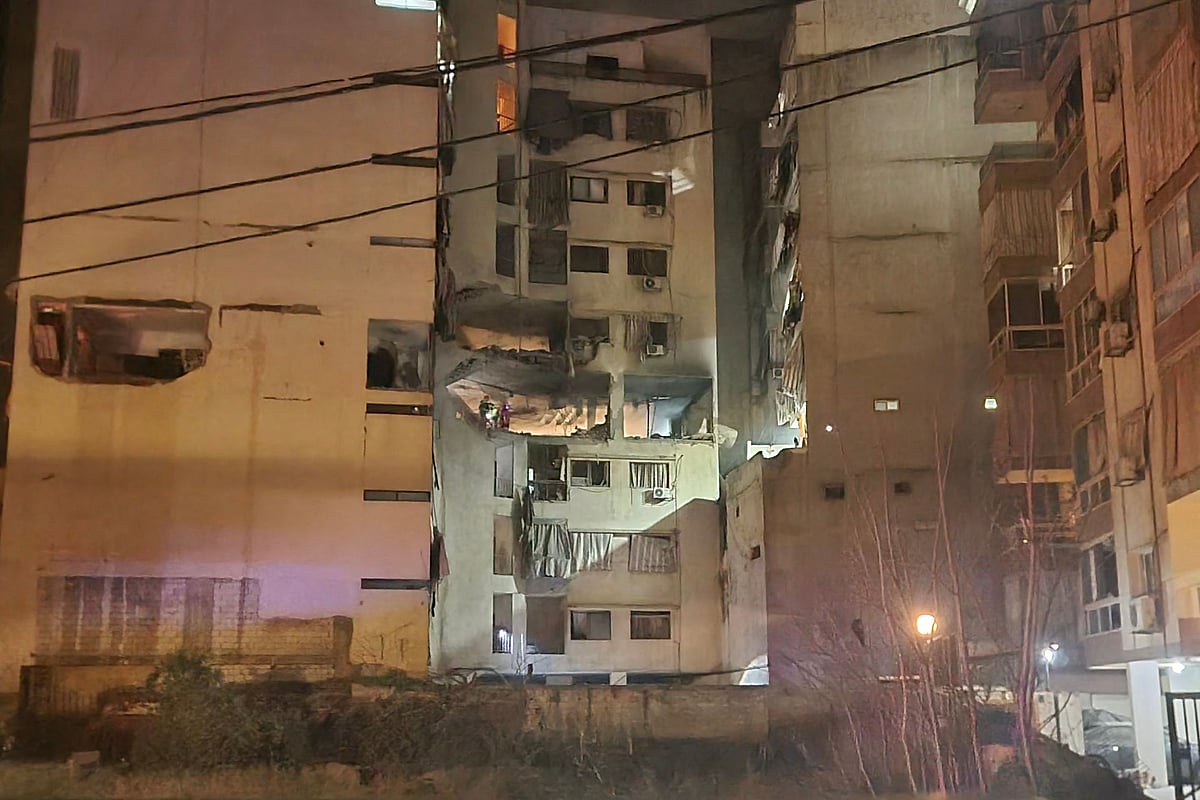 First aid responders inspect the site of an Israeli airstrike that targeted an apartment in the al Basta neighborhood in Beirut, on 18 March, 2026
