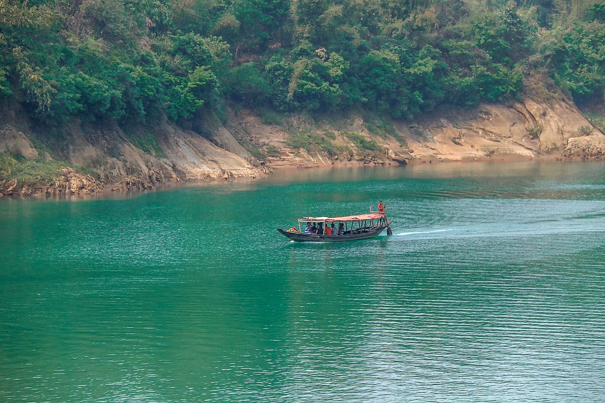 Tourists enjoy boat rides at Lalakhal.