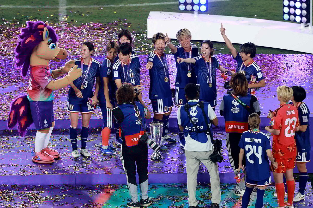 Japan's players celebrate winning the final of the AFC Women’s Asian Cup Australia 2026 football tournament between Australia and Japan at Stadium Australia in Sydney on 21 March 2026.