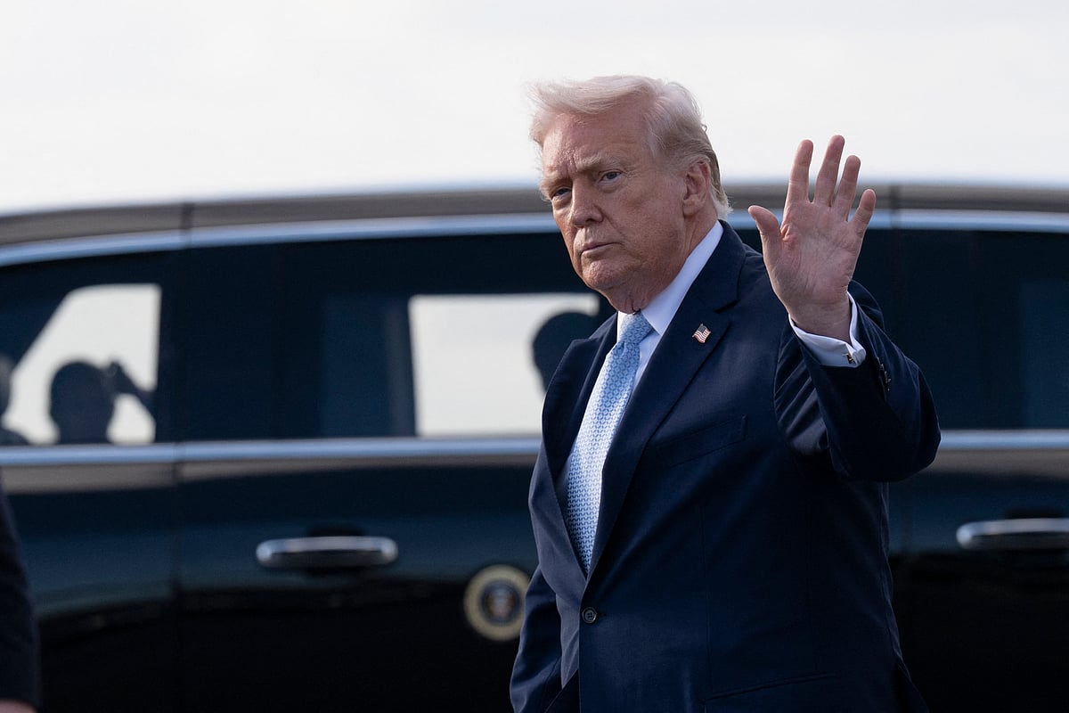 US President Donald Trump waves after landing at Palm Beach International Airport on 20 March 2026 in Palm Beach, Florida. President Trump is scheduled to spend the weekend at his South Florida estate of Mar-a-Lago in West Palm Beach