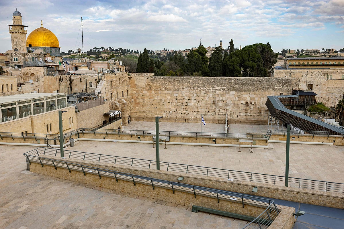 The Western Wall and the Dome of the Rock (L) are seen in Jerusalem's Old City on March 23, 2026. Since the United States and Israel unleashed strikes on Iran on February 28, war has spread across the Middle East, with casualties reported in countries across the region.