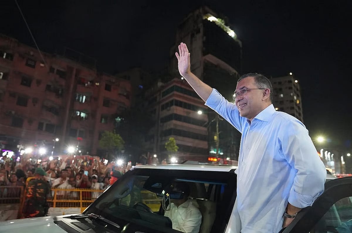 Prime Minister Tarique Rahman waves to party leaders and activists at BNP's central office in Nayapaltan on 28 March 