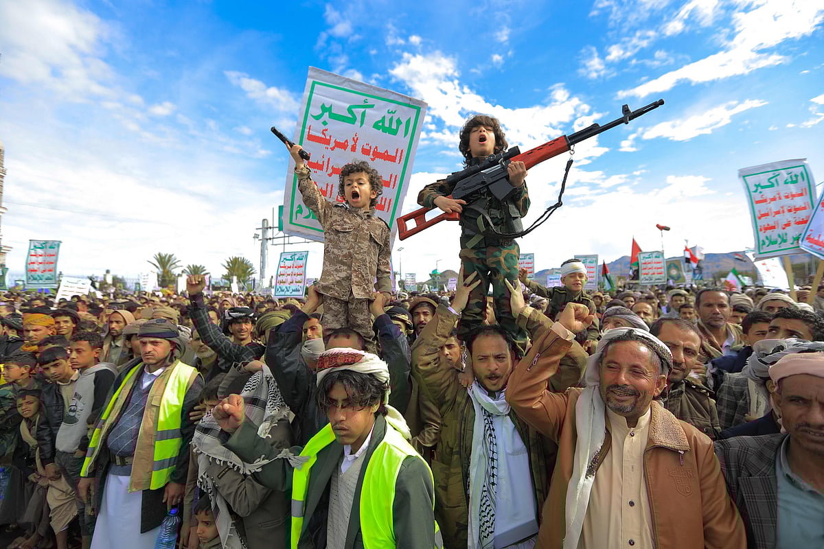 Young Houthi supporters hold weapons during a rally in solidarity with Iran and Lebanon, amid the US-Israeli war with Iran, in the Yemeni capital Sanaa on 27 March, 2026.