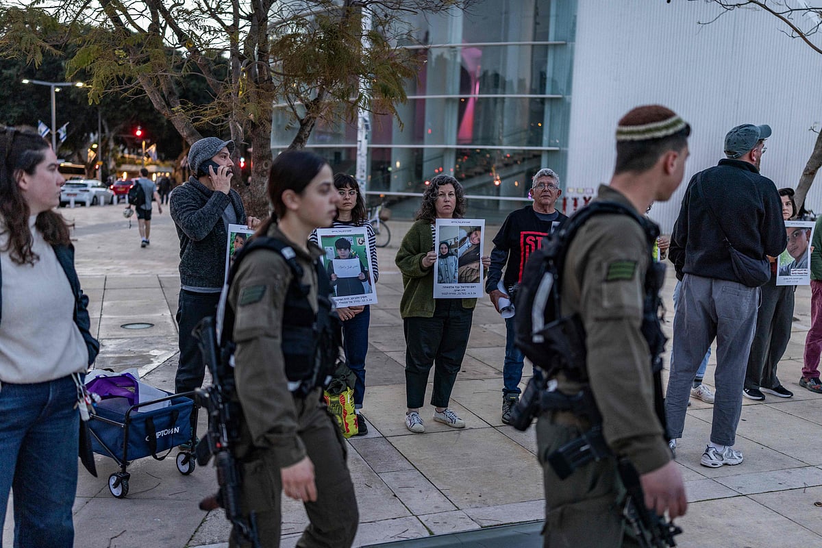 Israeli security forces watch a demonstrator gathering for the weekly anti-war protest at HaBima Square in Tel Aviv on 28 March, 2026. The US and Israel launched strikes against Iran on February 28, sparking swift retaliation by the Islamic republic which responded with missile attacks across the region.