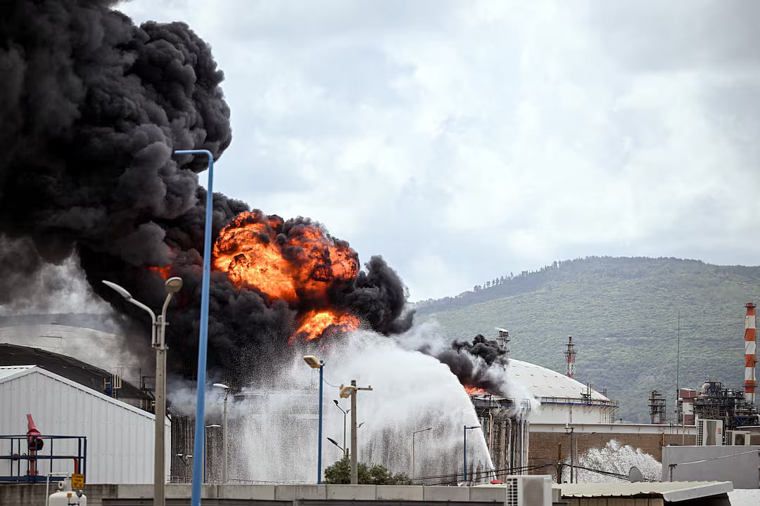 A blaze after Israel's Fire and Rescue Service said that an industrial building and fuel tanker at Israel's Oil Refineries were hit by debris from an intercepted Iranian missile, in Haifa, Israel, 30 March.