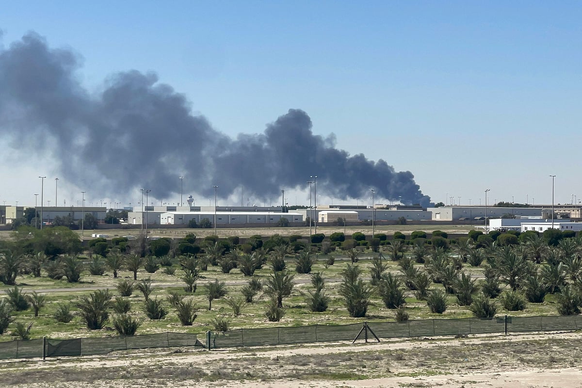 Smoke rises from an area of Kuwait's international airport after a reported drone strike on April 1, 2026. Kuwait's civil aviation authority said that the Gulf state's international airport had come under an Iranian drone attack that led to "a large fire" at a fuel depot.