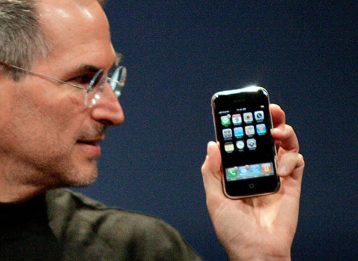 Apple Computer Inc. Chief Executive Officer Steve Jobs holds the new iPhone in San Francisco, California on 9 January 2007.