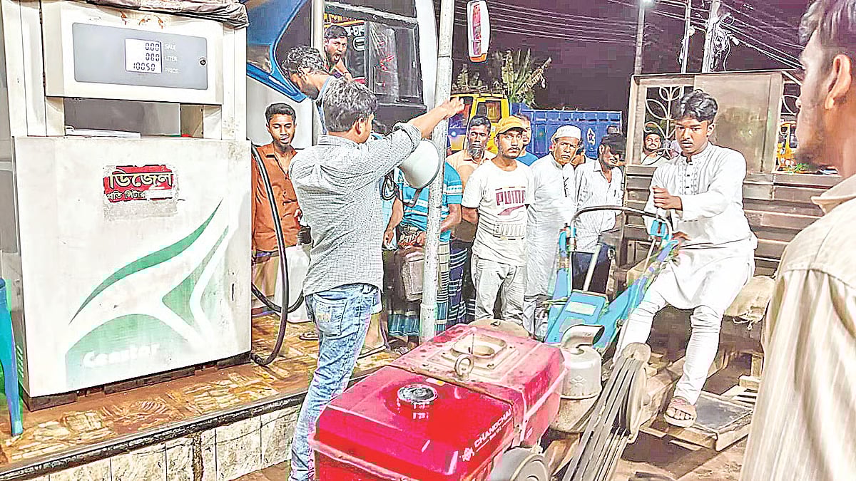 A man waits with a tractor to collect diesel at a filling station in the Baghia area of Shariatpur Sadar upazila on April 3, 2026. 