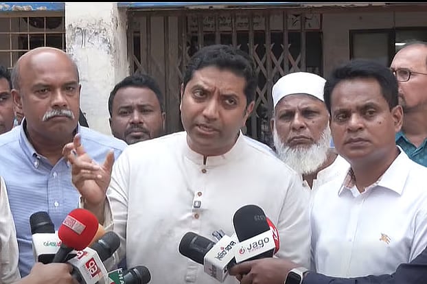 Primary and Mass Education State Minister Bobby Hajjaj speaks with journalists.