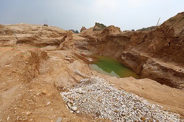 Large pits are forming due to stone extraction from Shah Arefin Tila in Companyganj Upazila, Sylhet. Photo taken on 24 March .