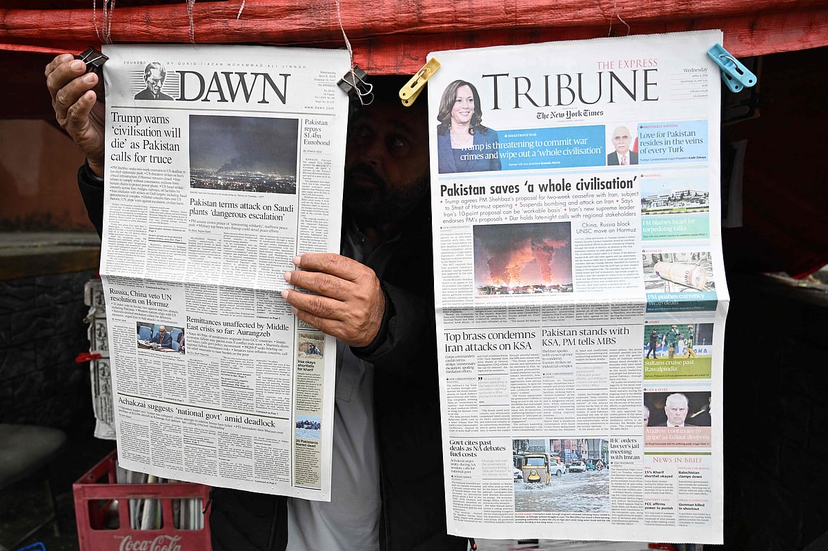 A vendor displays morning newspapers at his roadside stall in Islamabad on 8 April 2026. Pakistan’s Prime Minister Shehbaz Sharif said on 8 April that the United States, Iran and their allies had agreed to a ceasefire “everywhere”, including Lebanon, following mediation by his government to stop weeks of fighting