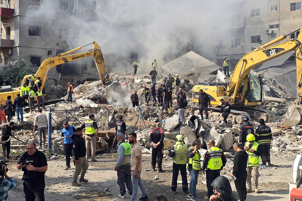 First responders rush to the site of an Israeli airstrike that targeted a building in southern Lebanese coastal city of Tyre on 8 April 2026