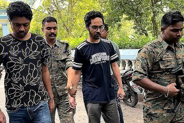 Prime accused in the killing of Sharif Osman Hadi, Faisal Karim Masud (centre), and his associate Alamgir Hossain (left) are produced before a court in West Bengal, India.