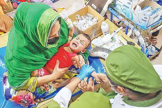 A child with measles undergoes treatment at the Infectious Diseases Hospital, Mohakhali, Dhaka. 
