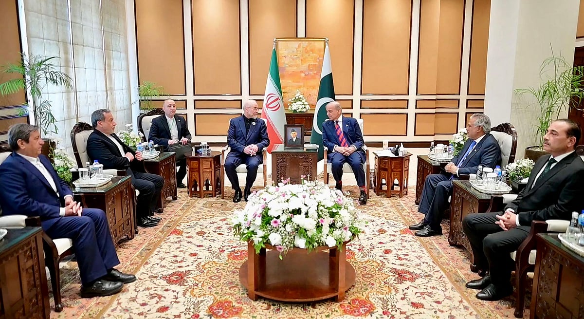 This handout photograph taken on April 11, 2026 and released by Pakistan's Prime Minister Office shows Pakistan's Army Chief and Field Marshal Syed Asim Munir (R), Foreign Minister Ishaq Dar (2R), Prime Minister Shehbaz Sharif (3R) during their meeting with Iran's parliamentary speaker Mohammad Bagher Ghalibaf (4L) and Foreign Minister Abbas Araghchi (2L) prior to the US-Iran peace talks in Islamabad.
