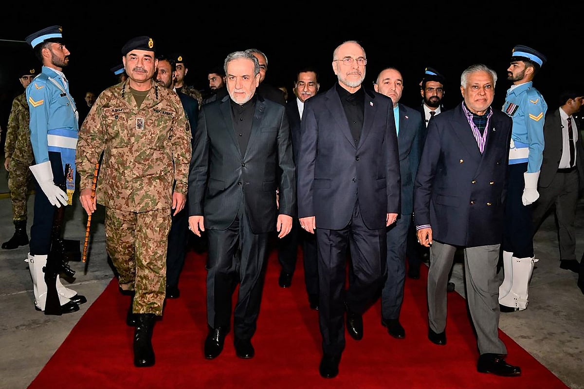 This handout photograph taken and released by Pakistan's Ministry of Foreign Affairs on 11 April 2026 shows Pakistan's Foreign Minister Ishaq Dar (2nd R) and Army Chief Syed Asim Munir (2nd L) walking with Iran's Foreign Minister Abbas Araghchi (centre L) and Iran’s Parliament Speaker Mohammad Bagher Ghalibaf (centre R) upon their arrival at Nur Khan air base in Rawalpindi, near Islamabad.