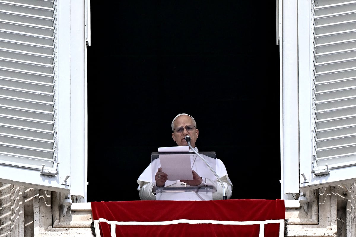 Pope Leo XIV addresses the crowd from the window of the apostolic palace overlooking St. Peter’s square during the Regina Caeli prayer in The Vatican on 12 April 2026