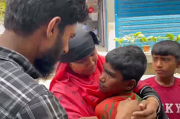 Saidul’s parents break down in tears after finding their son, who had gone missing five years ago. Beside them is his younger brother Minhaj. The photo was taken in the Purana Paltan area of the capital on Tuesday afternoon.