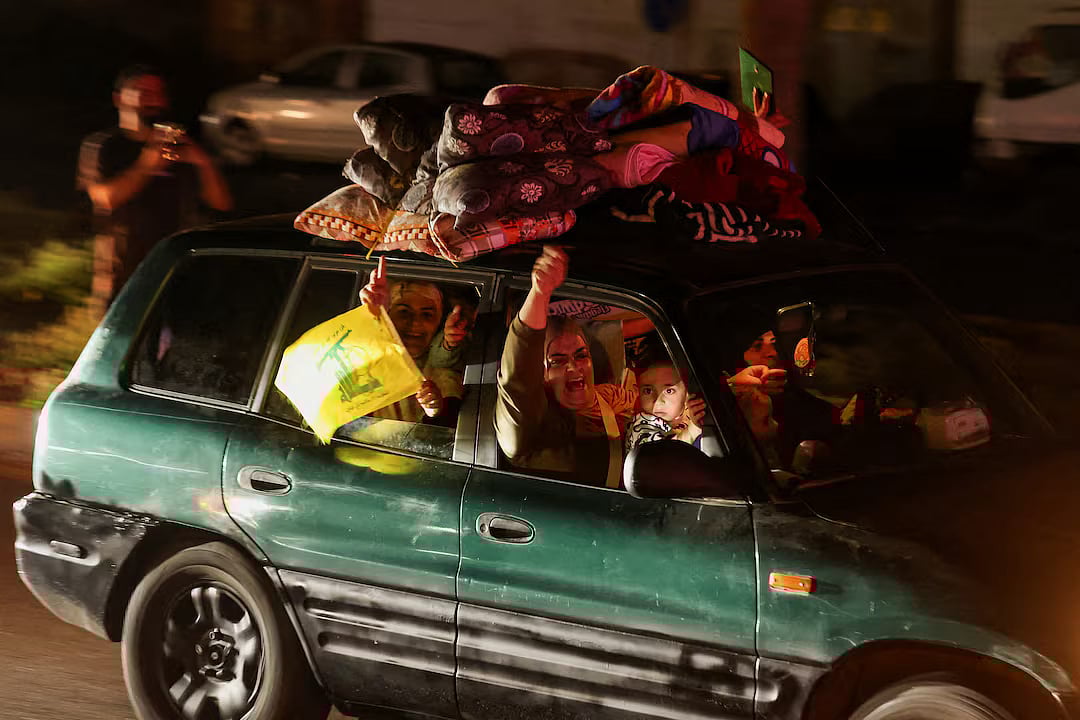 Displaced people react as they return to their homes in a vehicle carrying belongings on its roof after a 10-day ceasefire between Lebanon and Israel went into effect, in Sidon, Lebanon, 17 April, 2026.