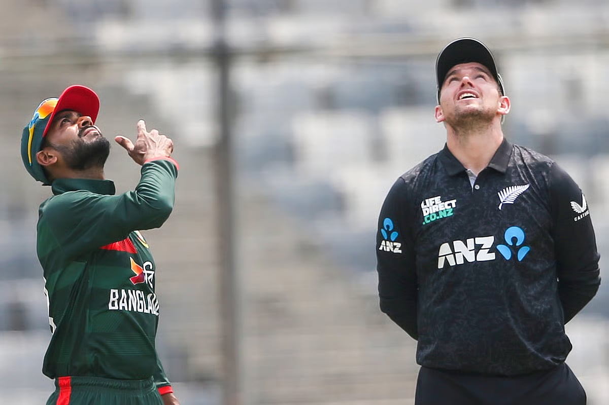 Mehidy Hasan flips the coin as New Zealand captain Tom Latham looks on