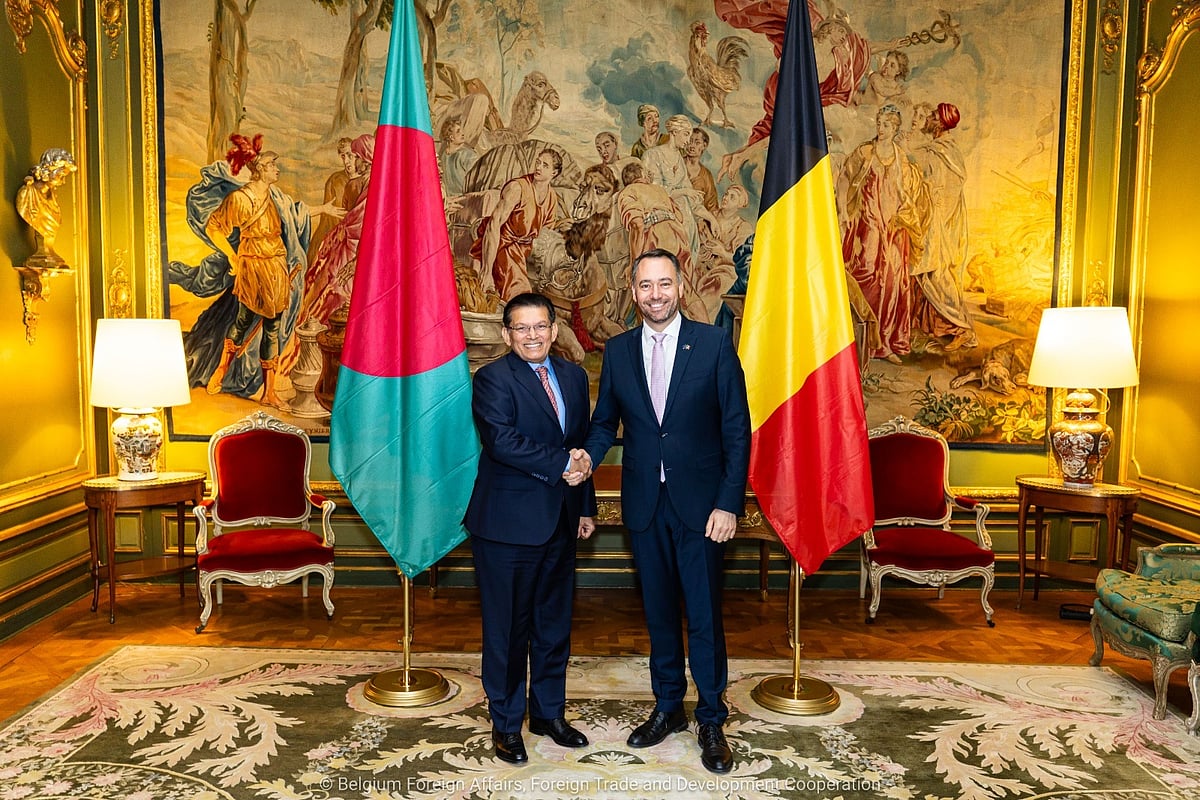 Foreign Minister Khalilur Rahman shaking his hand with Maxime Prévot, Deputy Prime Minister and Minister of Foreign Affairs, European Affairs and Development Cooperation of Belgium.