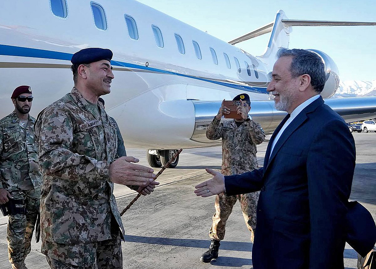 This handout photo taken and provided by the Iranian Foreign Ministry on April 15, 2026 shows Iran's Foreign Minister Abbas Araghchi (R) welcoming Pakistan's Army Chief Asim Munir upon his arrival at the airport in Tehran.