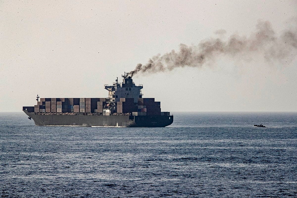 US forces patrol near the Iranian-flagged cargo ship M/V Touska after it was boarded and seized by U.S. forces on Sunday, at a location given as the Arabian Sea, in this handout image released 20 April 2026.