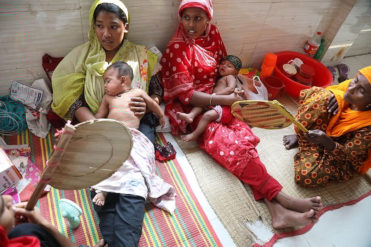 A child has fallen ill in the heat and has been brought to a hospital in Pabna. Yet there too there is load-shedding, leaving a hand fan as the only means of keeping the child cool. The photo is taken recently