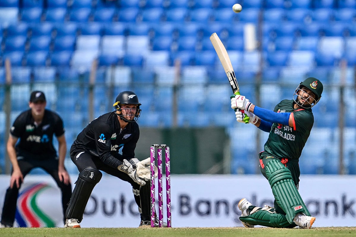 Bangladesh's Najmul Hossain Shanto (R) plays a shot as New Zealand's wicketkeeper captain Tom Latham watches during the third one-day international (ODI) cricket match between Bangladesh and New Zealand at the Bir Sreshtho Flight Lieutenant Matiur Rahman Stadium in Chittagong on April 23, 2026