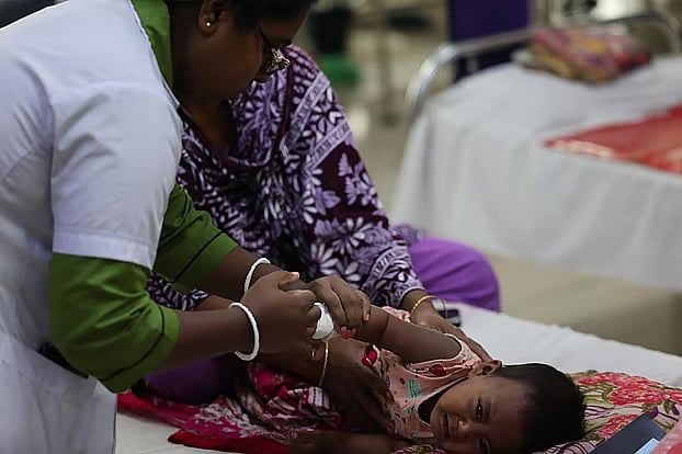 A child is being treated at the COVID-dedicated hospital under Dhaka North City Corporation in Mohakhali on Monday morning.