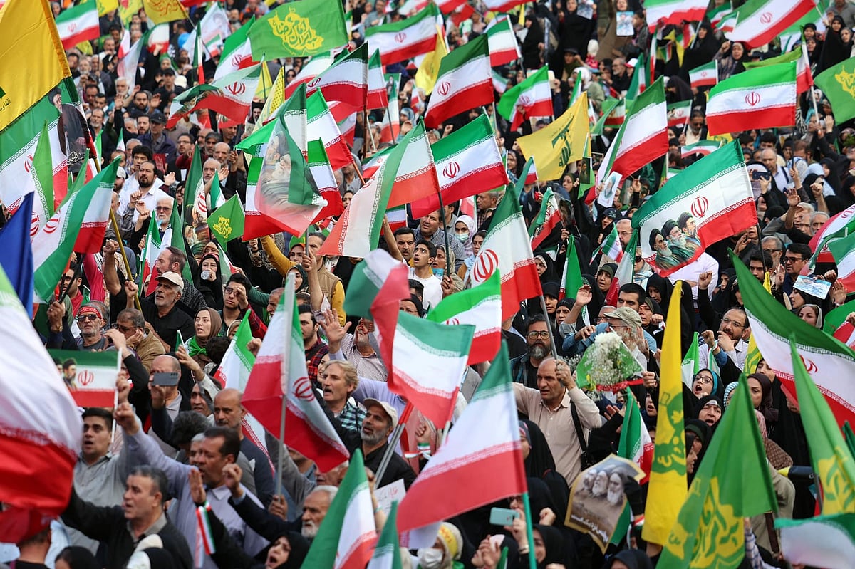 Iranians wave Irans national flags during a rally to show their solidarity and support to the new Iranian supreme leader Ayatollah Mojataba Khamenei in Tehran, on April 29, 2026. 